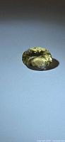 Top view of oval faceted golden heliodor gemstone