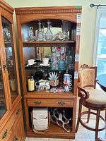 Front view of entire cabinet showing shelves, drawer, and open lower compartment