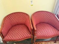 Front view of both armchairs showing upholstery pattern and frame