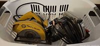 Both circular saws in laundry basket