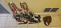 Pair of Cat Trail snowshoes, Easton skates, baseball, Mizuno glove