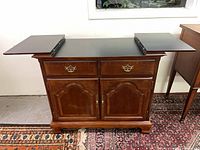 Front view of cabinet with leaves extended