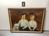 Full view of framed oil portrait painting