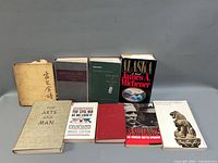 All nine books front covers and spines