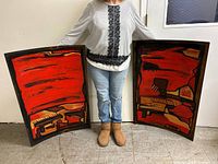 Front view showing both abstract oil paintings held side by side