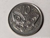 Reverse side with Maori tribal mask design and "10" denomination