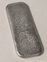 Full view of pewter ingot bar showing size and form