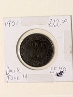 Coin in 2×2 flip showing reverse and handwritten details