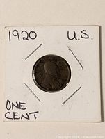 Coin in holder showing obverse side