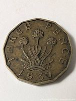 Reverse of 1937 threepence with thrift design and date