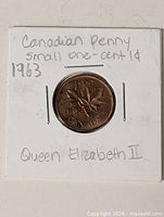 Front of cardboard flip showing 1963 Canadian 1-cent coin reverse