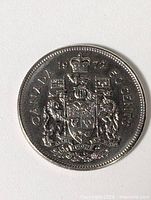 Reverse of 1972 Canada 50-cent coin showing coat of arms