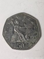 Reverse showing seated Britannia and denomination