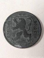 Obverse showing lion shield and bilingual legend