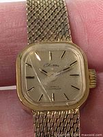 Close-up of dial showing Chateau logo, indices, cracked crystal