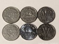 Six Canadian 5-cent coins front view