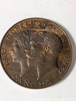 Full obverse view showing inscriptions and profiles