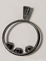 Rear view of pendant displaying 925 stamp on bail