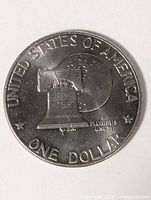 Reverse showing Liberty Bell over moon, ONE DOLLAR and UNITED STATES OF AMERICA legends