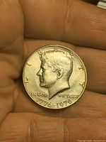 Obverse showing Kennedy portrait and dual date