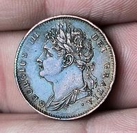 Obverse showing laureate bust of George IV and legend