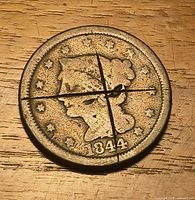 Obverse showing Matron Head design, date 1844, intersecting cuts