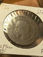 Obverse of 1855 Napoleon III copper coin in flip