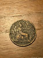 Reverse showing seated Britannia and 1862 date, corrosion visible