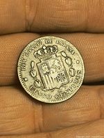 Reverse of 1878 Spanish 5 Centimos coin showing crowned arms and denomination