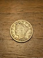 Obverse of 1902 Liberty Head V Nickel showing date and stars