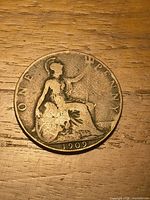 Reverse showing seated Britannia, date 1909 visible