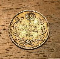 Reverse side showing 5 CENTS CANADA 1912 with crown and maple wreath