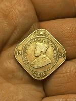 Obverse of 1920 India 2 annas coin showing King George V and date