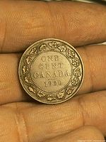 Reverse of 1920 Canada one cent showing legend and maple leaf wreath