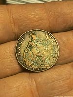 Reverse of 1923 half penny showing Britannia, toning