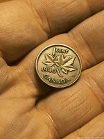 Reverse showing 1 CENT, 1940 date, two maple leaves, CANADA legend