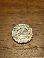 Reverse side showing beaver design and 1954 date