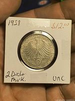 Reverse showing federal eagle, date 1958 and denomination 2 Deutsche Mark in cardboard flip
