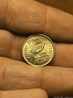 Reverse showing huia bird, denomination and year