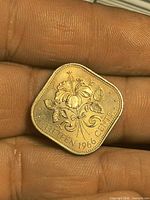 Reverse side showing hibiscus flower and denomination