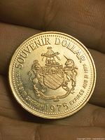 Obverse showing crest, Souvenir Dollar legend, validity date