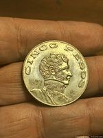 Obverse showing bust, legend CINCO PESOS and date 1977