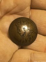 Obverse of concaved 1916 Canadian large cent showing King George V