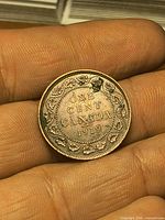 Reverse side showing denomination, country and date