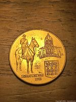 Obverse showing mounted RCMP officer, Legislative Building, provincial shield, date