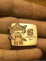Front of copper pin showing mascot and Vancouver 2010 Paralympic logo