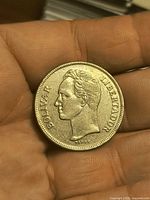 Obverse showing bust of Simón Bolívar and legend