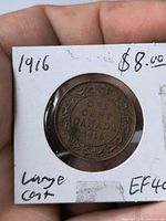 Reverse of 1916 Canadian cent showing denomination and date within decorative border