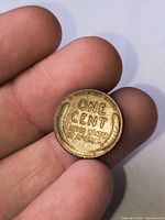 Reverse of 1929-D Lincoln Wheat cent showing ONE CENT UNITED STATES OF AMERICA and wheat ears