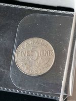 Reverse of 1932 Canada 5-cent coin showing denomination and date